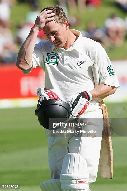 Craig Cumming of New Zealand leaves the field after being bowled out by Farveez Maharoof of Sri Lanka during day one of the second test match between...