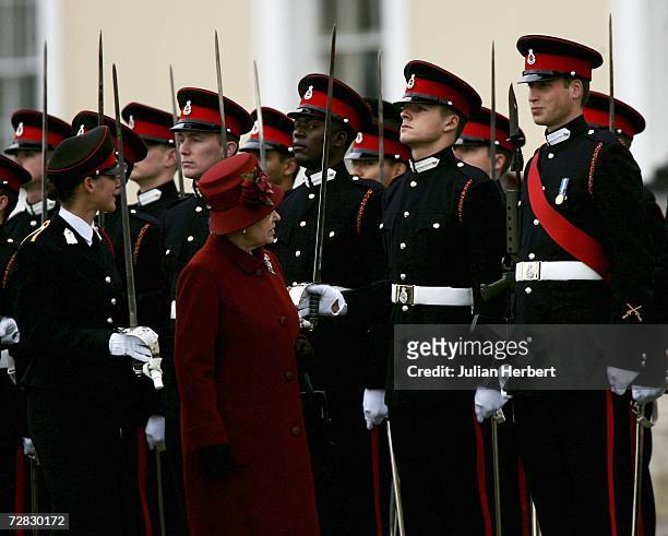 Prince William is inspected by his grandmother HM Queen Elizabeth II as he takes part in The Sovereigns Parade at The Royal Military Academy...