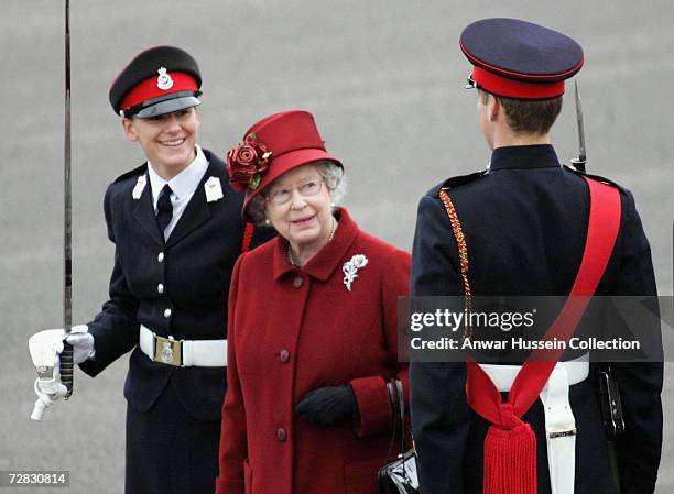 Queen Elizabeth ll inspects her grandson Prince William as he takes part in the Sovereign's Parade at the Royal Military Academy Sandhurst on...