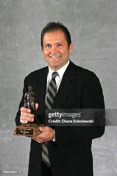 Reed Larson poses with his Lester Patrick Award during a ceremony on November 6, 2006 at the Joe Louis Arena in Detroit, Michigan. The award...