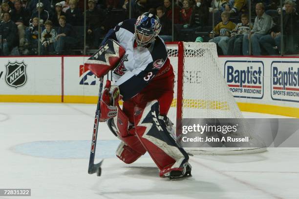 Pascal Leclaire of the Columbus Blue Jackets clears the puck against the Nashville Predators at Gaylord Entertainment Center on November 18, 2006 in...