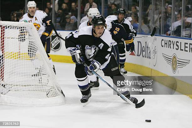 Vincent Lecavalier of the Tampa Bay Lightning skates to the puck against the Buffalo Sabres at St. Pete Times Forum on December 5, 2006 in Tampa,...