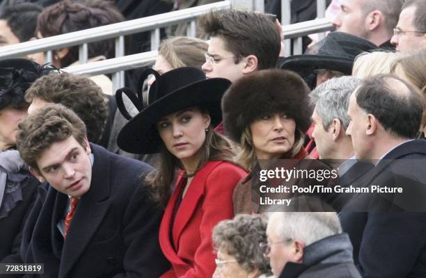 Kate Middleton, Prince William's girlfriend, sits with her parents Carole and Michael and Prince William's Private Secretary Jamie Lowther-Pinkerton...