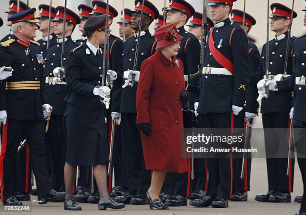 Prince William smiles as he is inspected by his grandmother, Queen Elizabeth ll, as he takes part in the Sovereign's Parade at the Royal Military...