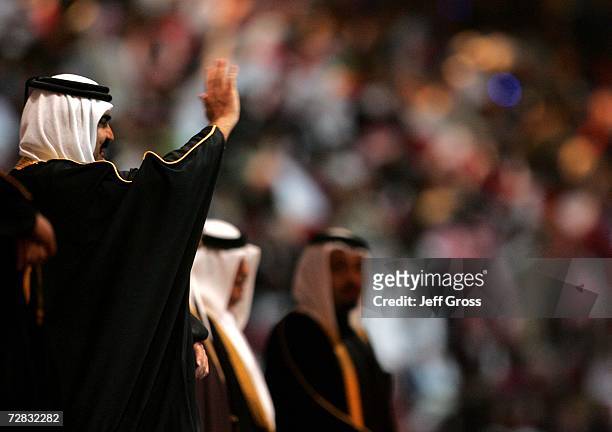 His Highness Sheikh Hamad Bin Khalifa Al-Thani, the Emir of the State of Qatar waves during the Closing Ceremony of the 15th Asian Games Doha 2006 at...