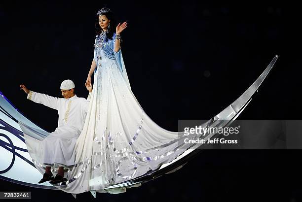 Scheherazade, the sorceress appears with a young Qatari boy on a moon during the Closing Ceremony of the 15th Asian Games Doha 2006 at the Khalifa...