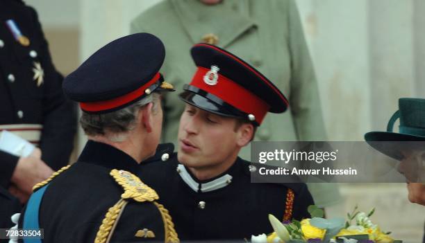 Prince William kisses his father, Prince Charles, Prince of Wales goodbye after he has taken part in the Sovereign's Parade at the Royal Military...