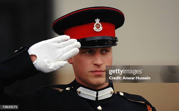 Prince William salutes after being commissioned as an officer in the British Army during the Sovereign's Parade at the Royal Military Academy...