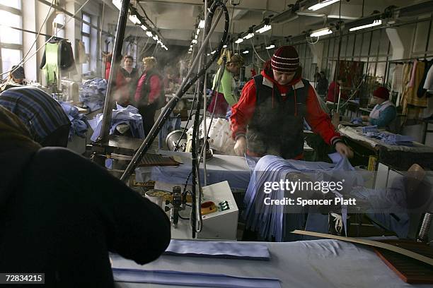Female inmates make police uniforms at the only female prison in Romania December 15, 2006 in Targsor, Romania. The prison, with inmates from 17 to...