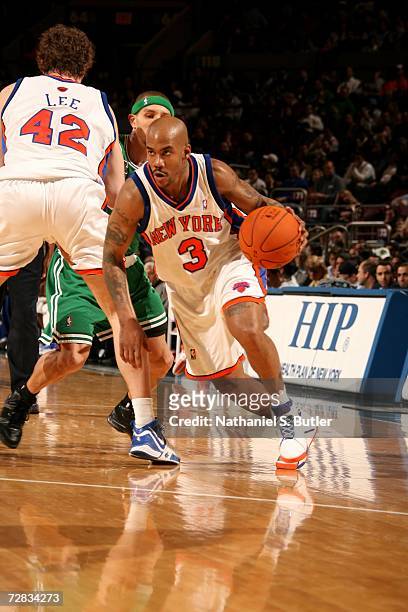 David Lee of the New York Knicks sets a pick on Delonte West of the Boston Celtics so Stephon Marbury on the Knicks can drive to the basket during...