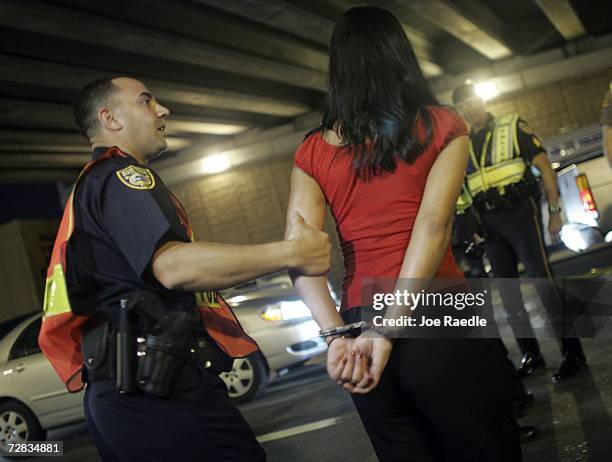 Woman Police Officer Arresting