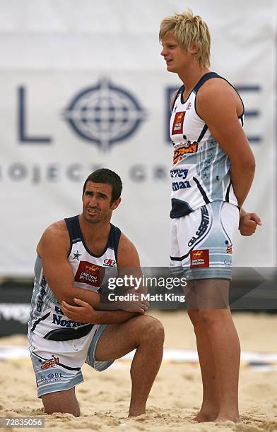 Andrew Johns and AFL player Nick Riewoldt look on at the Harvey Norman Beach Footy event at Maroubra Beach on December 16, 2006 in Sydney, Australia....