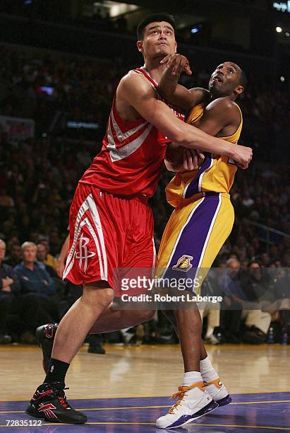 Kobe Bryant of the Los Angeles Lakers and Yao Ming of the Houston Rockets during the second half of the game at the Staples Center on December 15,...