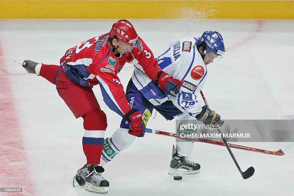 Finland's Juha-Pekka Haataja (R) vies wi