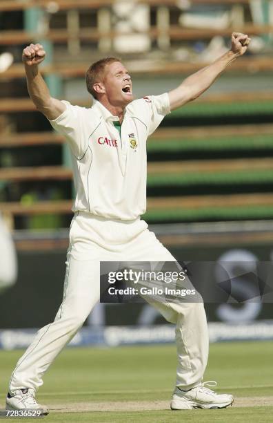 Shaun Pollock of South Africa celebrates his 400th Test wicket by claiming Rahul Dravid for 1 run during Day Two of the First Test between South...