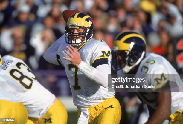 Drew Henson of the Michigan Wolverines pulls back to pass during the game against the Northwestern Wildcats at the Ryan Field in Evanston, Illinois....