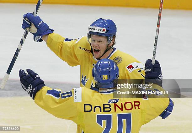 Moscow, RUSSIAN FEDERATION: Sweden's Daniel Fernholm and Tim Eriksson celebrate a goal at the match of Euro Hockey Tour against Czech Republic in...