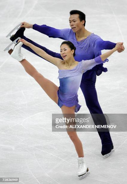 Chinese Xue Shen and Hongbo Zhao perform for the first place during pair's free skating program at ISU Grand Prix Figure Skating final in St....