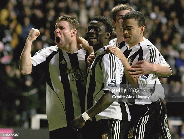 Obafemi Martins of Newcastle United celebrates after scoring the opening goal against Watford with James Milner and Kieron Dyer during the Barclays...
