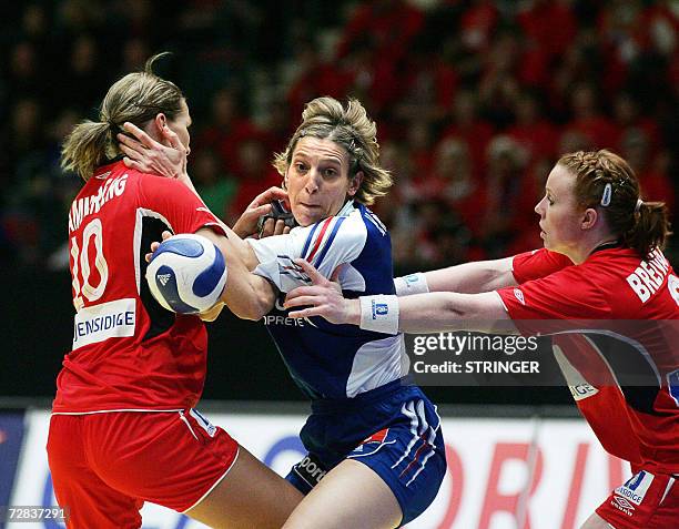 Norway's defenders Gro Hammerseng and Karoline Dyhre Breivang block France's Veronique Rolland Pecqueux during their in the semi-final of the women's...