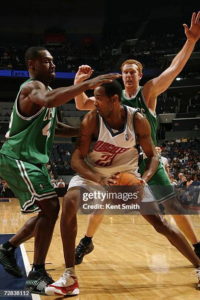 Tony Allen and Brian Scalabrine of the Boston Celtics guard Derek Anderson of the Charlotte Bobcats at the Charlotte Bobcats Arena December 16, 2006...