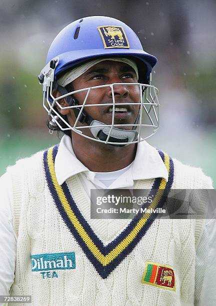 Chaminda Vaas of Sri Lanka walks from the field in light rain after being caught out fro 47 runs during day three of the second test match between...