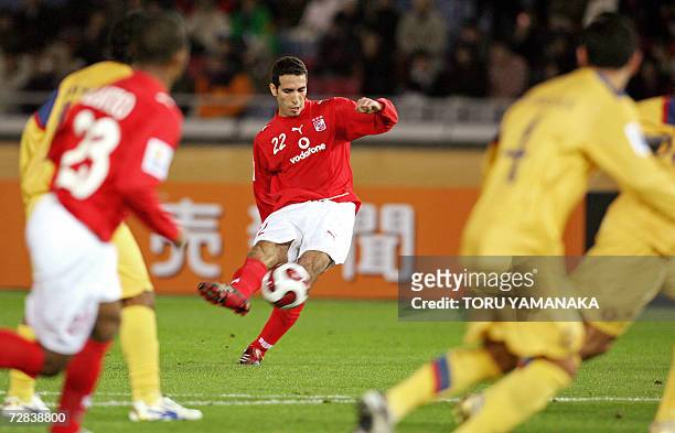 Egyptian Al-Ahly forward Mohamed Aboutrika takes a free kick against Mexico's Club America during the third-place play-off of the FIFA Club World Cup...