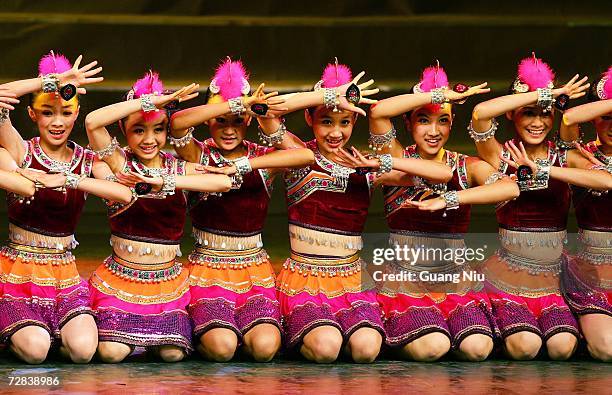 Chinese students perform during the launch ceremony of the Heart-to-Heart Partnership Program of Beijing 2008 Olympic Games on December 17, 2006 in...