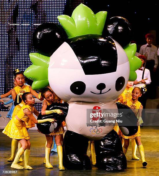 Chinese students perform during the launch ceremony of the Heart-to-Heart Partnership Program of Beijing 2008 Olympic Games on December 17, 2006 in...