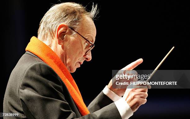 Italian composer Ennio Morricone conducts the Christmas concert in Milan's Piazza Duomo 16 December 2006. Morricone, the man behind the memorable...