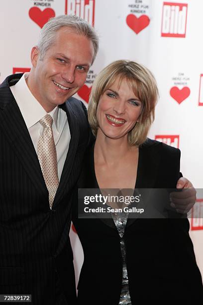 Television hostess Marietta Slomka and her husband television host Christof Lang attend the Herz fuer Kinder charity gala at Axel Springer Haus...