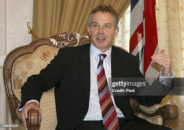 British Prime Minister Tony Blair meets gestures during his meeting with the Iraqi President Jalal Talabani on December 17, 2006 in Baghdad, Iraq....
