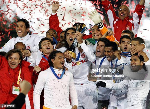 Players of Sport Club Internaciona celebrate with the cup after winning the final of the FIFA Club World Cup Japan 2006 between Sport Club...