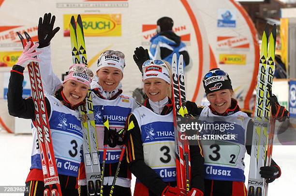 German team members Claudia Kuenzel-Nystac, Stefanie Boehler, Evi Sachenbacher and Viola Bauer, celebrate after winning the women's nordic skiing...