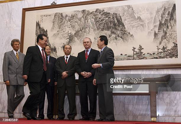 Envoys representing the six nations attending talks gather for a photo Russia's Sergey Ravoz, North Korea's Kim Kye Gwan, South Korea's Chun...