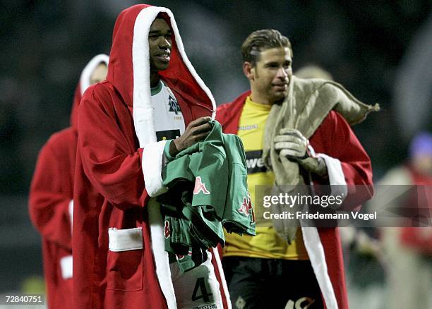 Naldo and Tim Wiese of Werder, wear a Santa Claus coat as they celebrates after winning the Bundesliga match between Werder Bremen and VFL Wolfsburg...