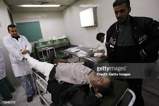 Veteran French journalist, Didier Francois, working for the French Liberation daily newspaper, is treated by medics at the al-Shifa Hospital after...