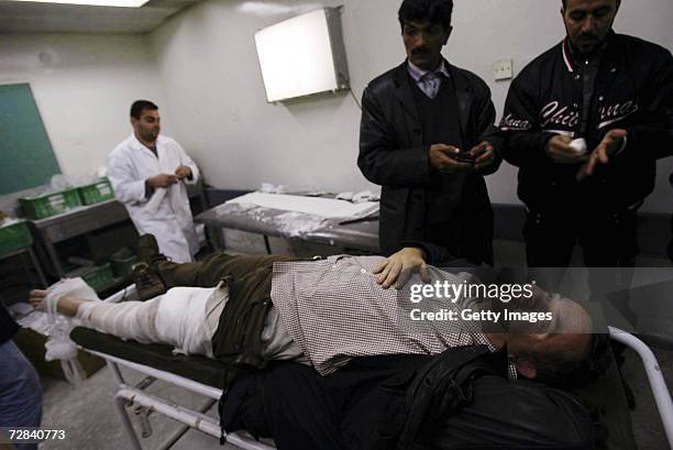 Veteran French journalist, Didier Francois, working for the French Liberation daily newspaper, is treated by medics at the al-Shifa Hospital after...