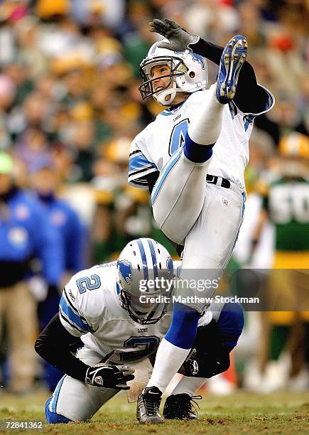 Nick Harrris of the Detroit Lions holds as Jason Hanson kicks a field goal against the Green Bay Packers at Lambeau Field December 17, 2006 in Green...