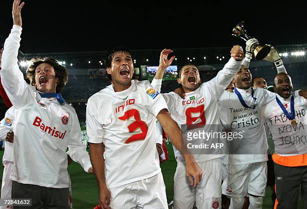 Players of Brazil's SC Internacional celebrate their victory against FC Barcelona after their final match for the FIFA Club World Cup Japan 2006 at...