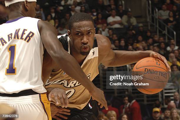 Gilbert Arenas of the Washington Wizards drives to the hoop against Smush Parker of the Los Angeles Lakers on December 17, 2006 at Staples Center in...