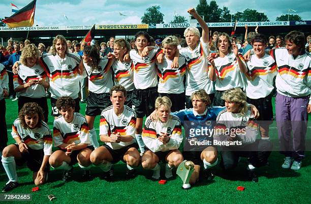 Team Germany pose with the trophy after winning the UEFA Euro 1991 final between Norway and Germany on July 14, 1991 in Aalborg, Denmark.