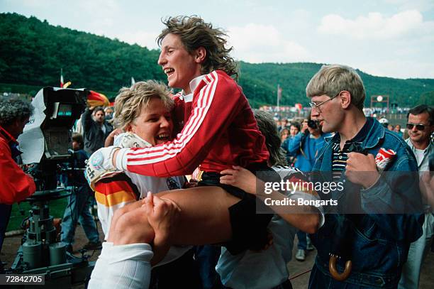 Marion Isbert of Germany celebrates with teammate Doris Fitschen after winning the UEFA Women's Euro 1989 final between Germany and Italy on July 2,...