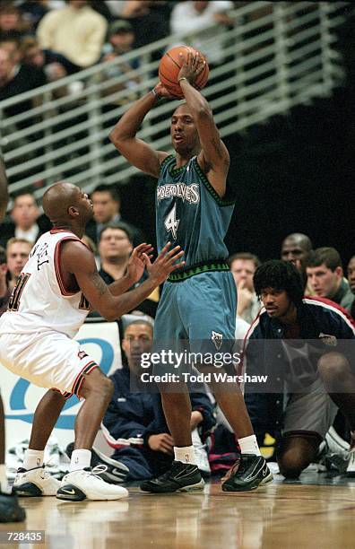 Chauncey Billups of the Minnesota Timberwolves gets ready to pass the ball as Nick Van Exel of the Denver Nuggets gaurds him during the game at the...