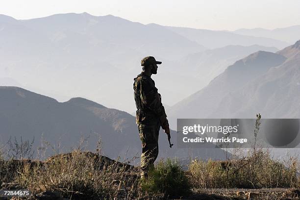 Pakistani soldier stands watch during military exercises on December 18, 2006. In Abbottabad, Pakistan. Pakistan and China completed 10 days of...