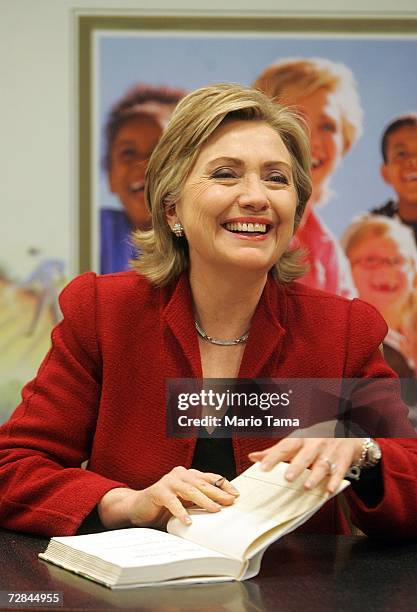 Sen. Hillary Rodham Clinton appears at a book signing promoting the tenth anniversary rerelease of her book "It Takes a Village" December 18, 2006 in...