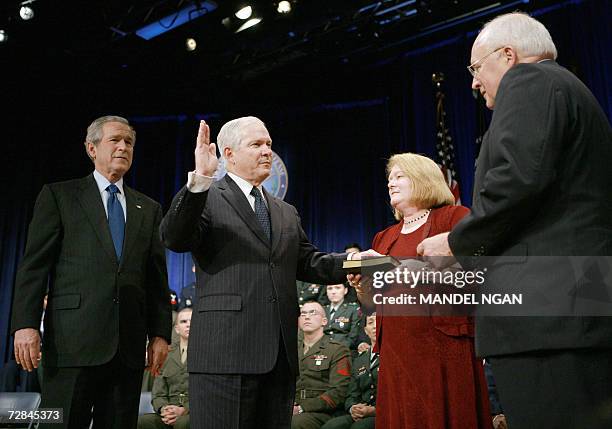 Washington, UNITED STATES: Robert Gates is sworn-in by Vice President Dick Cheney as the 22nd US defense secretary as US President George W. Bush and...