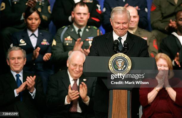 Robert Gates recieves applause by US President George W. Bush Vice President Dick Cheney and Becky Gates after he was sworn in as Defense Secretary...