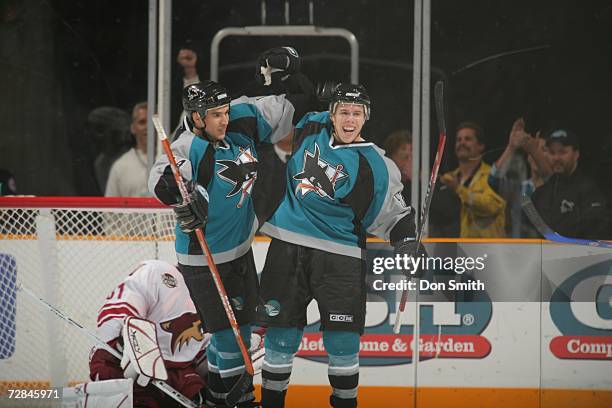 Joe Pavelski and Johnathan Cheechoo of the San Jose Sharks celebrate a goal during a game against the Phoenix Coyotes on December 11, 2006 at the HP...