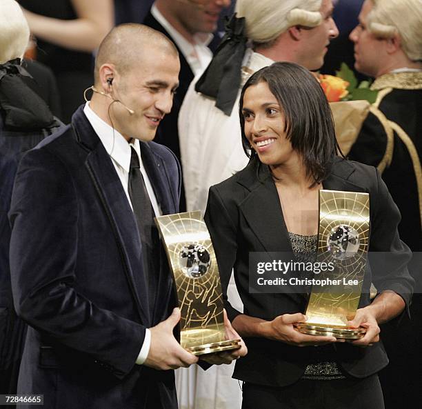 Winners Fabio Cannavaro of Italy and Real Madrid with the FIFA World Player of the Year Award and Marta of Brazil with The FIFA Womens World Player...